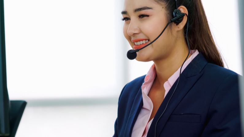 Customer support agent provide service on telephone video conference call.