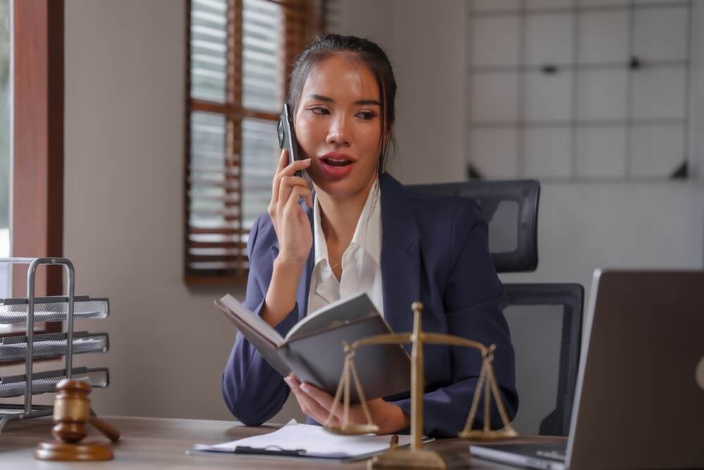 Asian female people in formal suit with digital legal consultation, business executives with online attorney, e-meeting with lawyer, virtual law consultation, corporate legal advisor online

