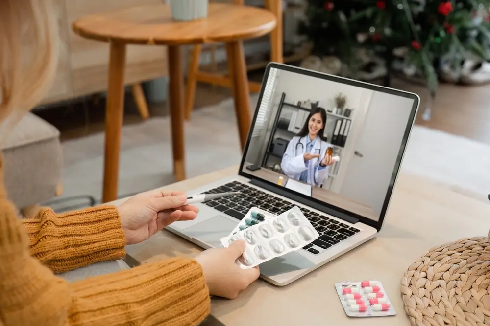 Female virtual assistant Provides Online Health Advice via Video Call on Laptop in Modern Home Setting
