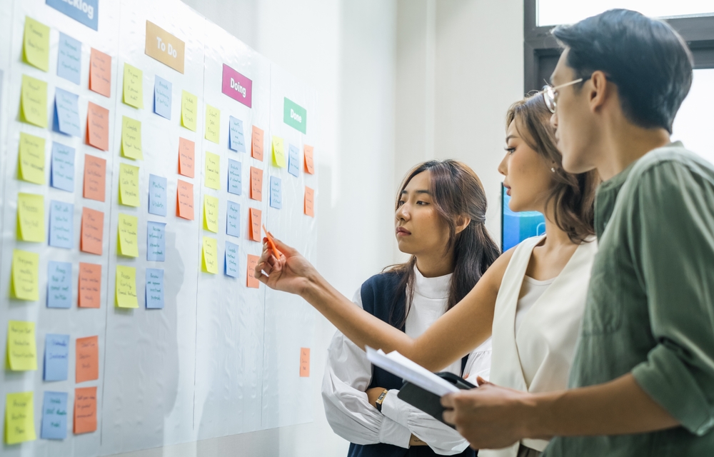 brainstorming session, using sticky notes on a task board