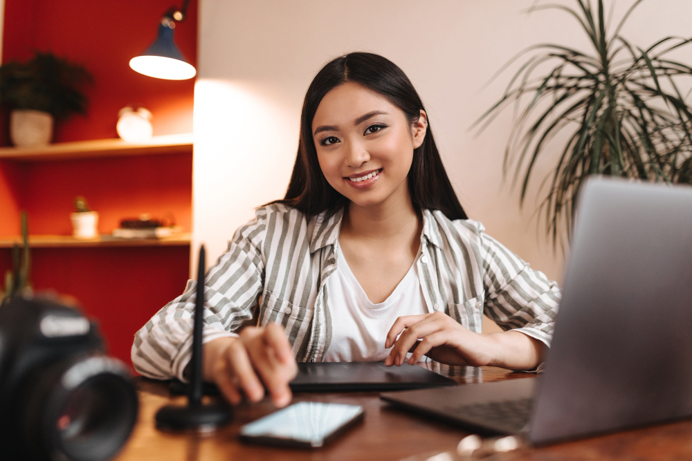 striped shirt smiling and posing in workplace