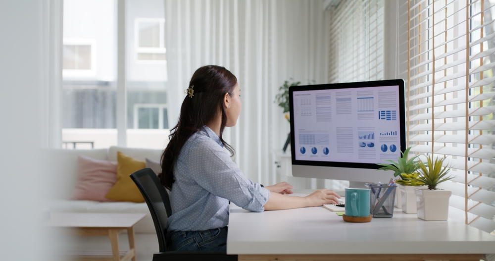 Smart Gen Z tech talent workforce typing SEO sale report on desktop P