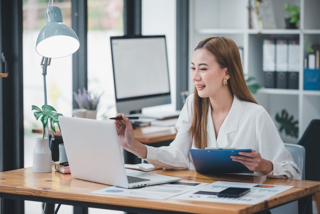 Virtual assistant in front of her laptop