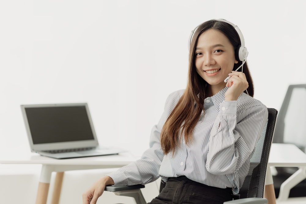 Beautiful virtual assistant wearing a wireless headset