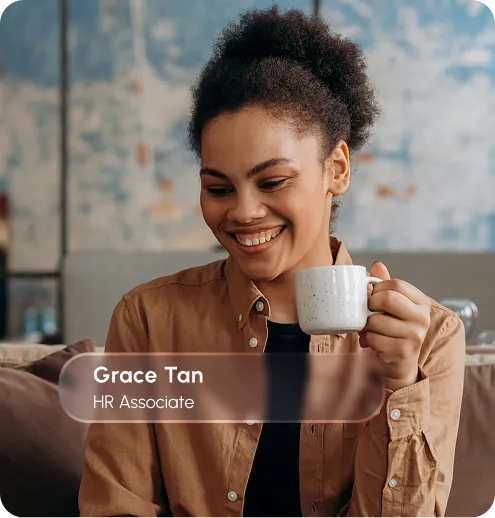 Grace Tan, an RRPA associate, poses confidently in a business environment, dressed in formal attire.