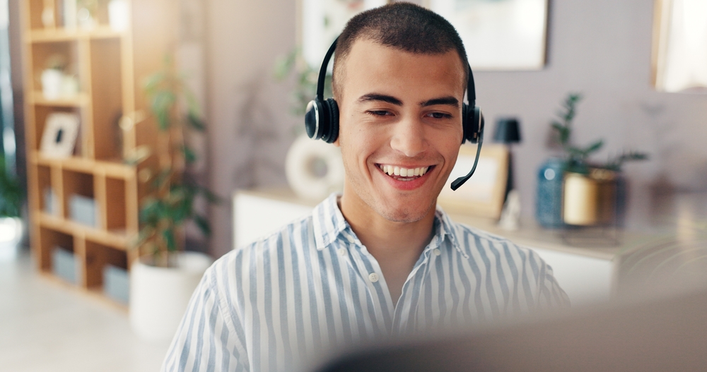 Virtual assistant, remote work and man with headset in home for customer support and online help