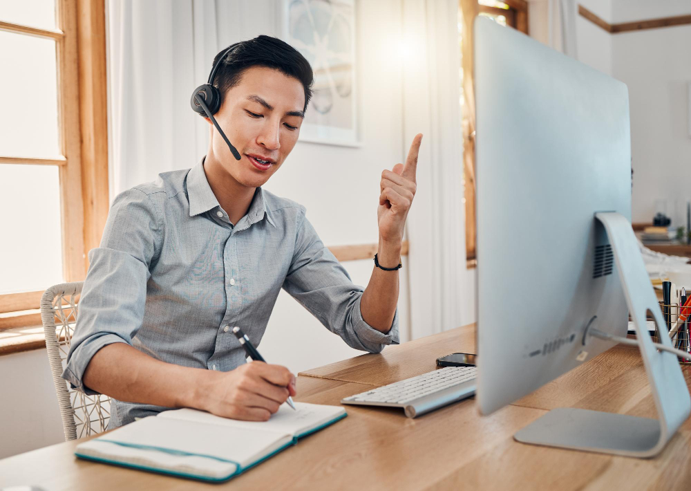 Customer support telemarketing and writing with a man consultant