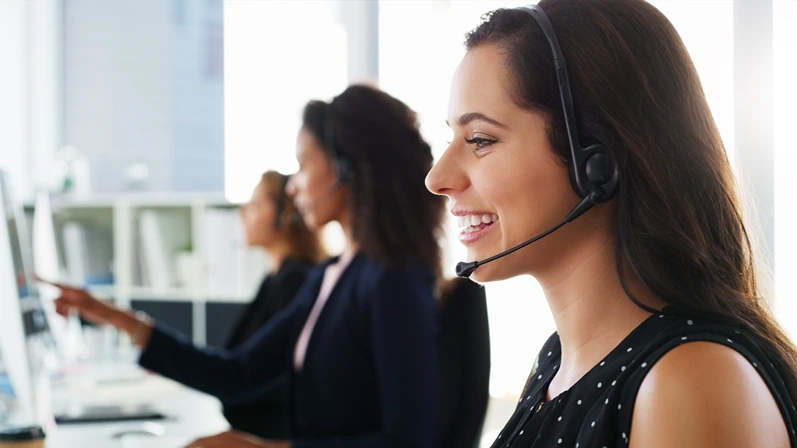 Happy woman, consultant and agency with headset for customer service in call center office. Female person, friendly agent or team profile with smile or mic for online advice or virtual assistance